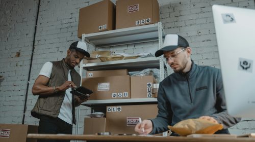 Carefully packed clothing items in boxes, ready for return or exchange – representing efficient eCommerce returns.